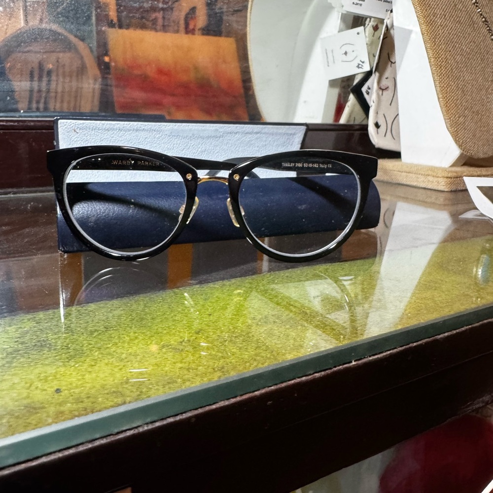 Warby Parker Stylish Black Eyewear with gold accents